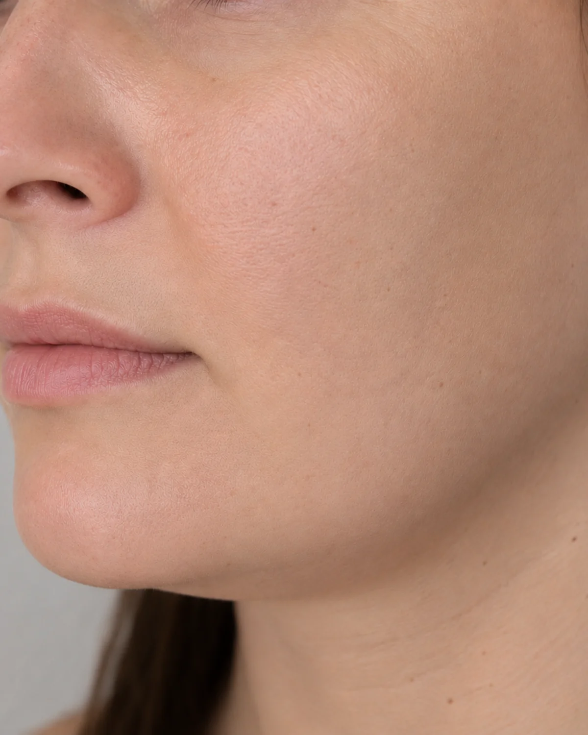 Side profile showing early softening along the jawline